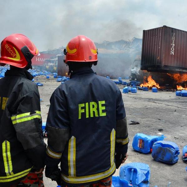Two days after deadly blasts, Bangladesh container depot still burns