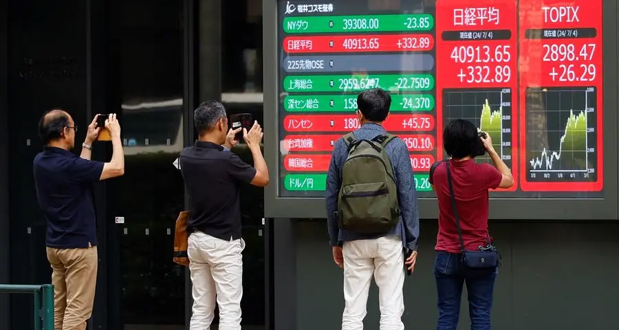 Japan's Nikkei drops from record peak on chip sell-off, yen intervention risks