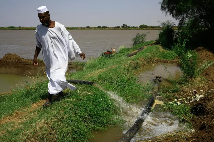 A farmer opens an irrigation pipe from the Nile river to a canal, a in al-Gezira state, 250kms south of Sudan's capital, on September 26, 2022. - The Pharaohs worshipped it as a god, the eternal bringer of life, but the clock is ticking on the Nile. Climate change, pollution and exploitation by man is putting existential unsustainable pressure on the world's second longest river on which millions of Africans depend. (Photo by ASHRAF SHAZLY / AFP)