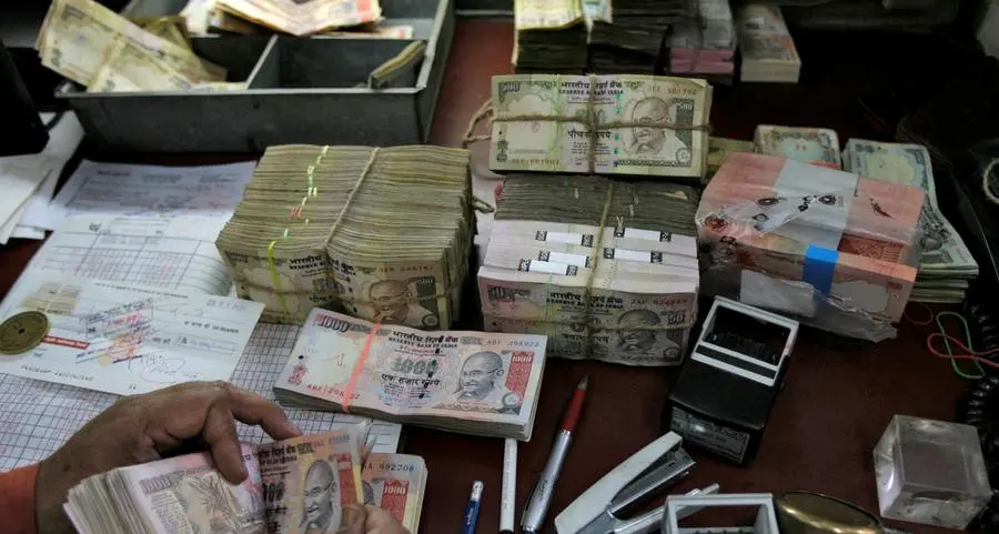 Indian rupee nearly flat as oil companies' dollar bids counter gains in Asia FX