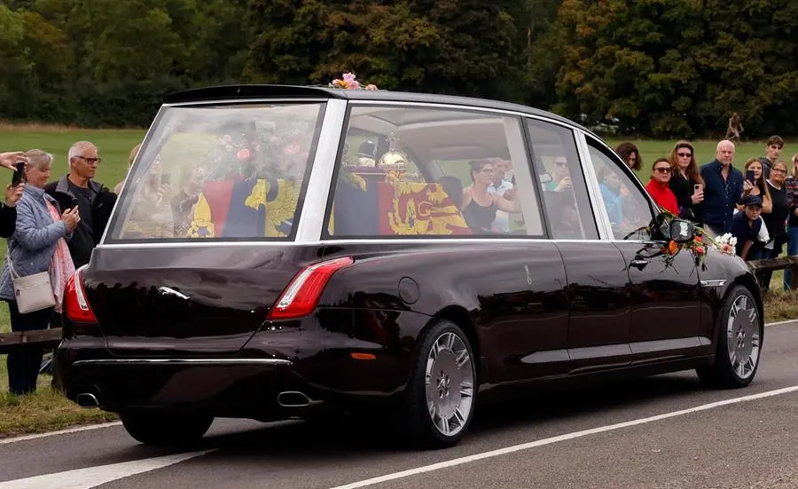 The hearse carrying the coffin of Britain's Queen Elizabeth travels to Windsor, on the day of the state funeral and burial of Britain's Queen Elizabeth, in Runnymede, Britain, September 19, 2022 REUTERS/Andrew Couldridge