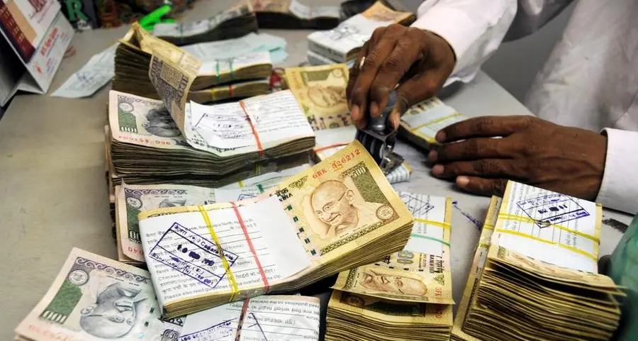 Indian rupee edges lower tracking Asian peers, forward premiums rise