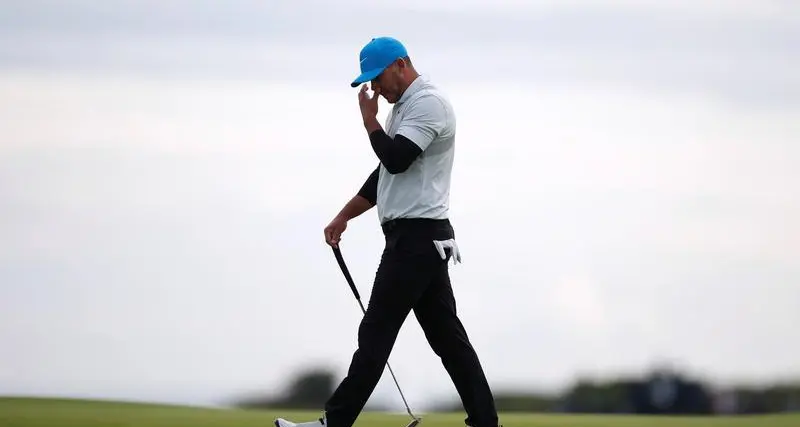 Koepka storms into Masters lead before weather halts play