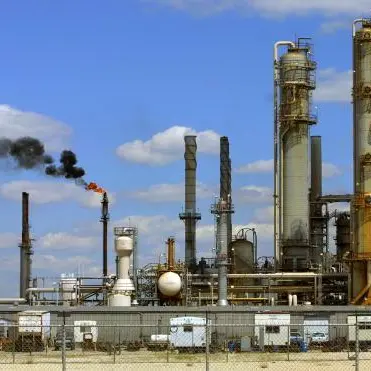 Oil slips towards $57 as economic gloom weighs