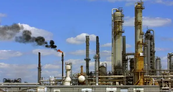 Oil slips towards $57 as economic gloom weighs