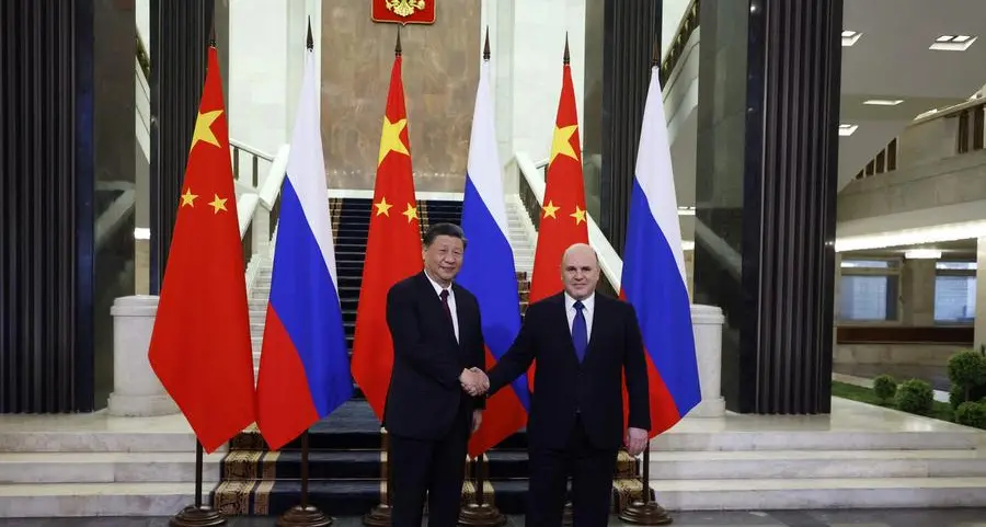 Xi calls Russia ties priority on Moscow trip