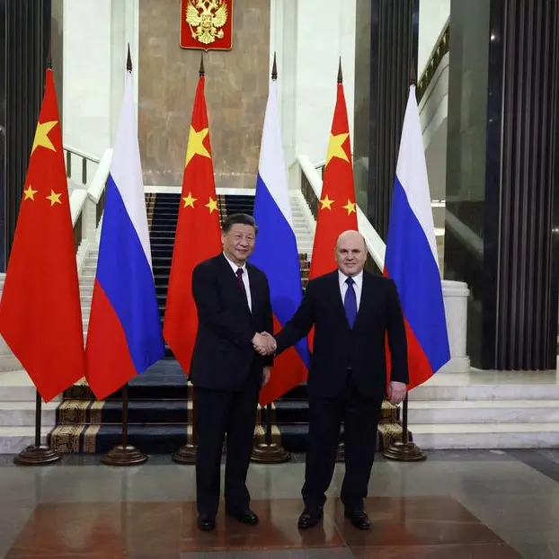 Xi calls Russia ties priority on Moscow trip