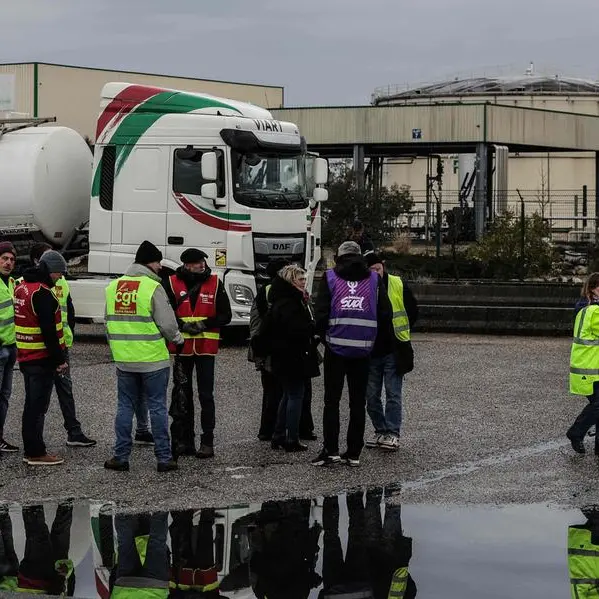French roads blocked, refineries on strike after Macron pension move