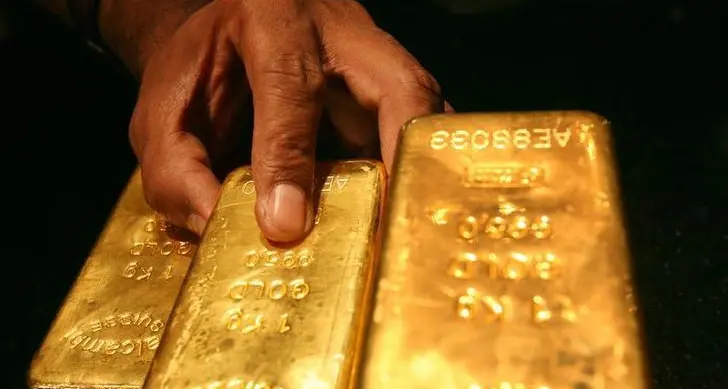 Gold stalls as firmer dollar counter slower rate-hike hopes