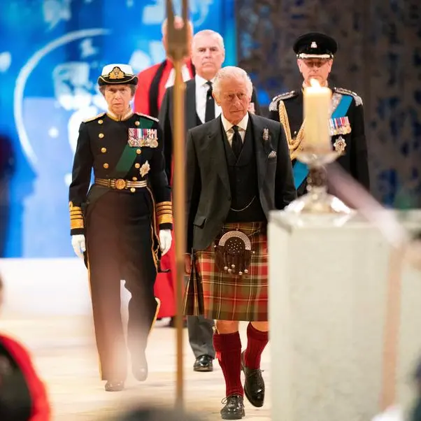 King Charles stands vigil as queen's lying-in-state queue swells