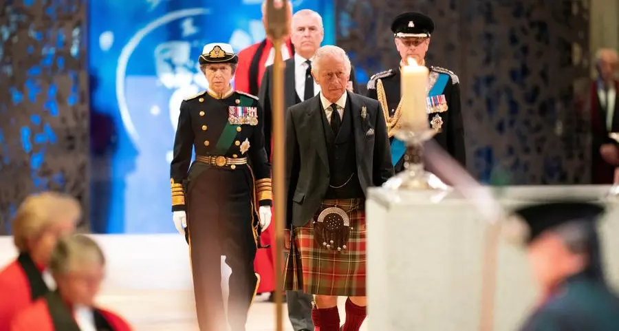 King Charles stands vigil as queen's lying-in-state queue swells