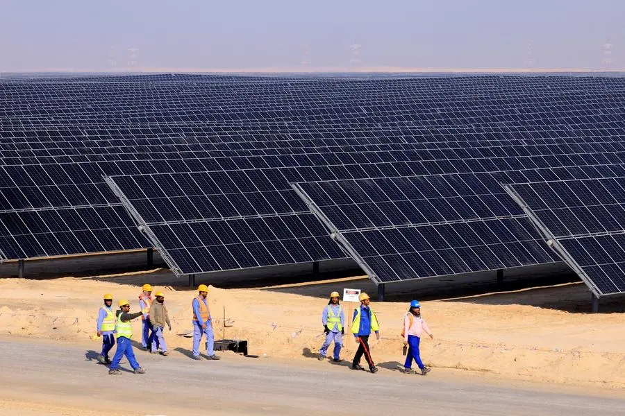 Image used for illustrative purpose. Employees walks at Al Dhafra Solar Photovoltaic (PV) Independent Power Producer (IPP) project, in the United Arab Emirates\\' capital Abu Dhabi, during a visit by the French economy minister on January 31, 2023. (Photo by Karim SAHIB / AFP) , AFP