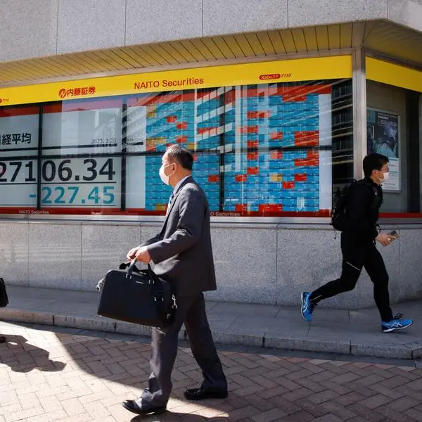 Japan's Nikkei bounces as weaker yen lifts sentiment; banks weigh