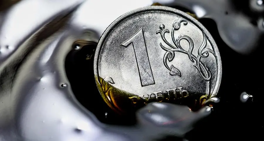 Russian rouble climbs to one-week high vs dollar as tax period begins