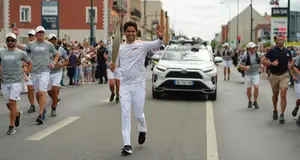 PSG President Nasser Al-Khelaïfi takes part in Olympic torch relay in Paris ahead of opening ceremony