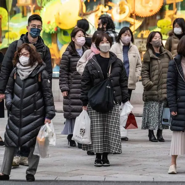 Japan to drop mask guidance, relax Covid strategy