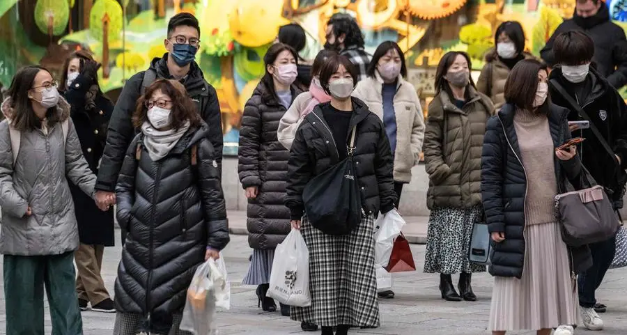 Japan to drop mask guidance, relax Covid strategy