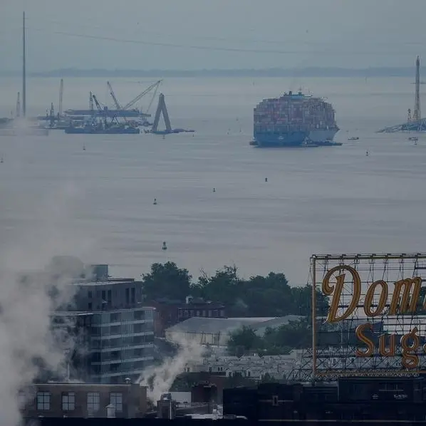 Crashed ship that took down Baltimore bridge refloated, towed from channel