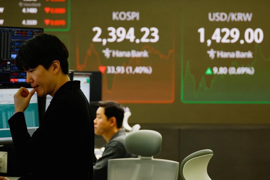 Asian assets slide as Mideast strikes spark oil spike, haven rush