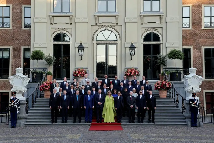 Turkey\\'s President Tayyip Erdogan, U.S. President Donald Trump, Dutch King Willem-Alexander and Dutch Queen Maxima, France\\'s President Emmanuel Macron, Italian Prime Minister Giorgia Meloni, Canadian Prime Minister Mark Carney, Ukraine\\'s President Volodymyr Zelenskiy, Britain\\'s Prime Minister Keir Starmer, Greek Prime Minister Kyriakos Mitsotakis, Danish Prime Minister Mette Frederiksen, Sweden\\'s Prime Minister Ulf Kristersson, German Chancellor Friedrich Merz, Slovakia\\'s President Peter Pellegrini, Spanish Prime Minister Pedro Sanchez, Poland\\'s outgoing President Andrzej Duda, European Commission President Ursula von der Leyen, European Council President Antonio Costa, NATO Secretary General Mark Rutte and NATO heads of state and governments pose for a picture ahead of a dinner hosted by Dutch King Willem-Alexander and Dutch Queen Maxima, on the sidelines of a NATO Summit, at Huis ten Bosch Palace in The Hague, Netherlands June 24, 2025. REUTERS/Christian Hartmann. , Reuters