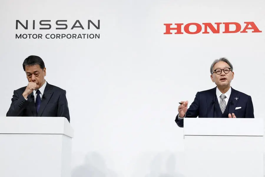 FILE PHOTO: Makoto Uchida, Director, Representative Executive Officer, President and CEO of Nissan Motor Corporation and Toshihiro Mibe, Director, President and Representative Executive Officer of Honda, attend a joint press conference on their merger talks, in Tokyo, Japan, December 23, 2024. REUTERS/Kim Kyung-Hoon. , Reuters
