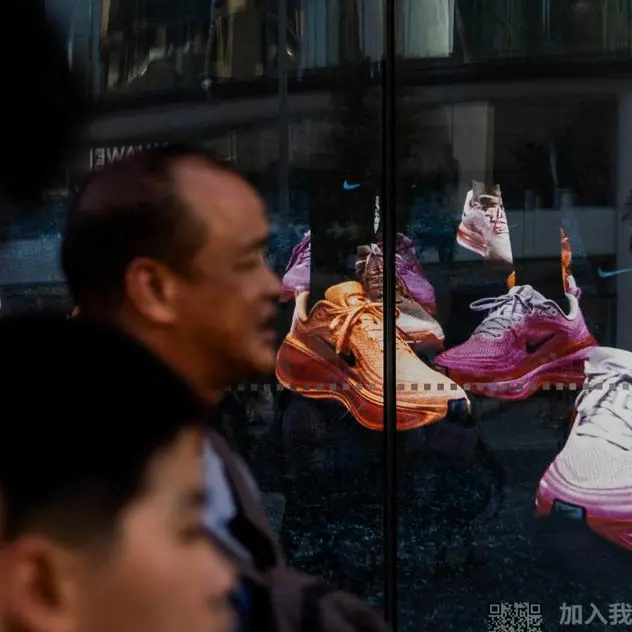 Futures edge higher on tech rebound, Nike slumps on China pain