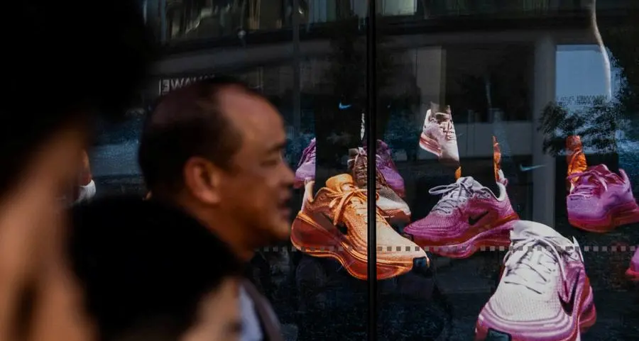 Futures edge higher on tech rebound, Nike slumps on China pain