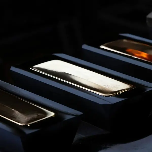 Gold languishes near 7-month low as Fed tightening bets boost dollar