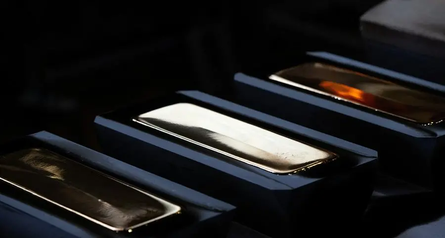 Gold languishes near 7-month low as Fed tightening bets boost dollar