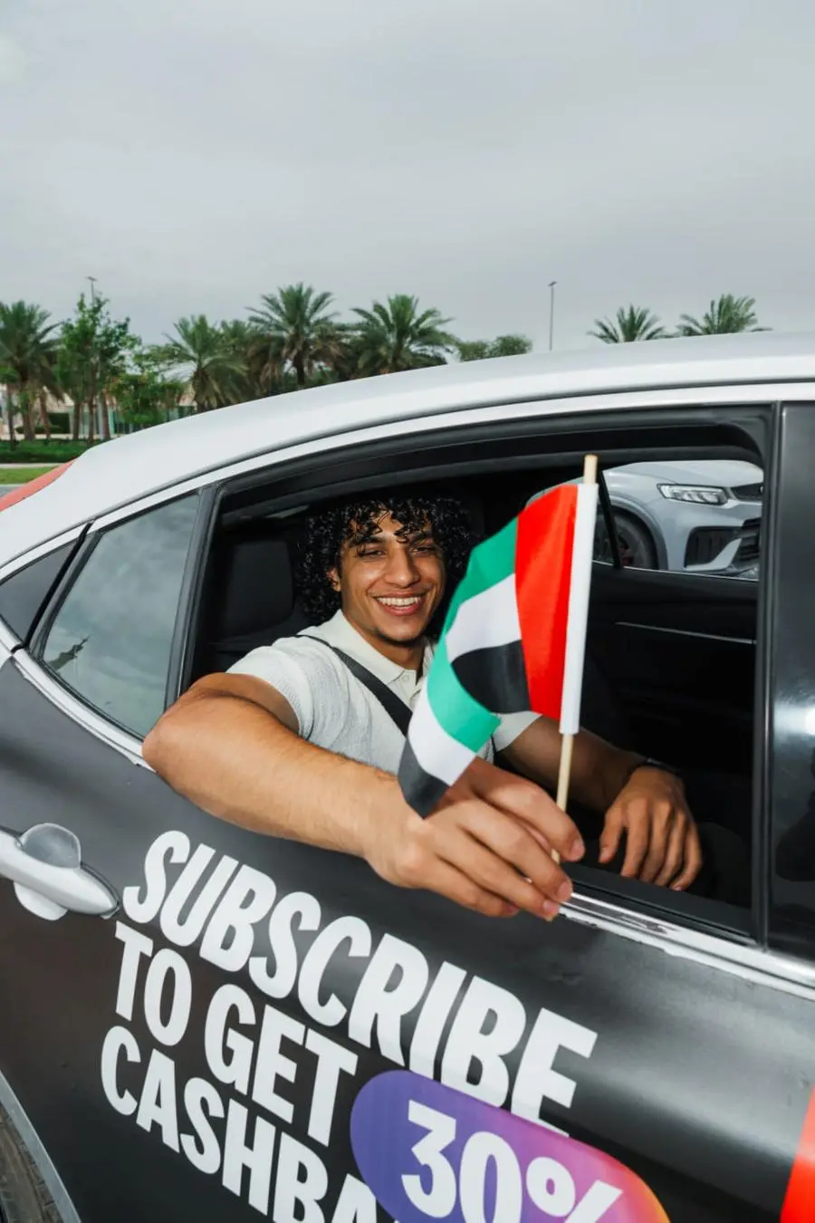 Passenger using Yango ride hailing via smartphone