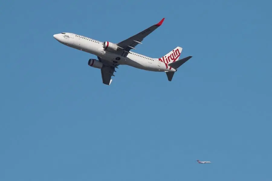 FILE PHOTO: A Virgin Australia Airlines plane takes off from Kingsford Smith International Airport in Sydney, Australia, March 18, 2020. REUTERS/Loren Elliott. , Reuters