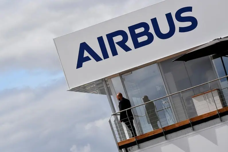 FILE PHOTO: A man stands at an Airbus trade pavilion at Farnborough International Airshow in Farnborough, Britain, July 17, 2018. REUTERS/Toby Melville. Image used for illustrative purpose. , Reuters Images