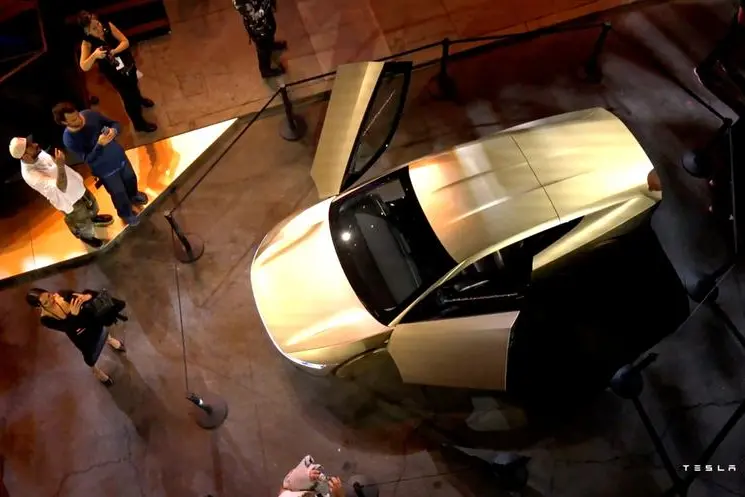 Tesla\\'s robotaxi is displayed at an unveiling event in Los Angeles, California, U.S. October 10, 2024, in this still image taken from a video. Tesla/Handout via REUTERS.