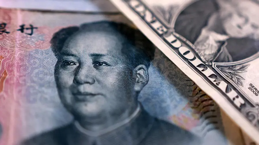 China state-owned banks soak up dollars to slow yuan gains, sources say