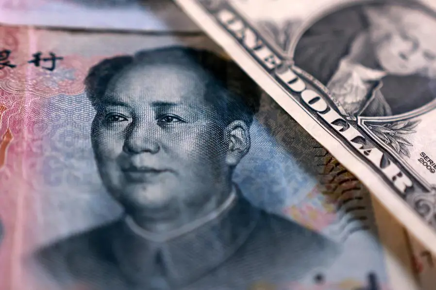 China state-owned banks soak up dollars to slow yuan gains, sources say