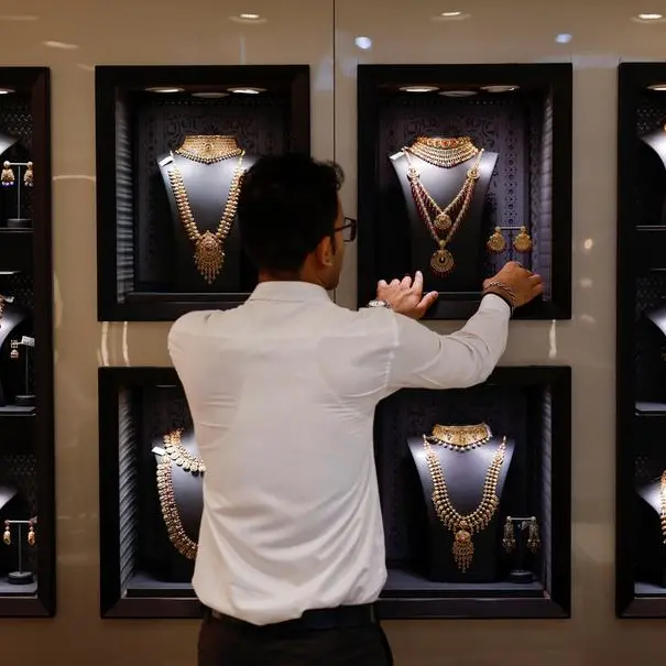 Gold prices slide further as dollar firms, investors book profits