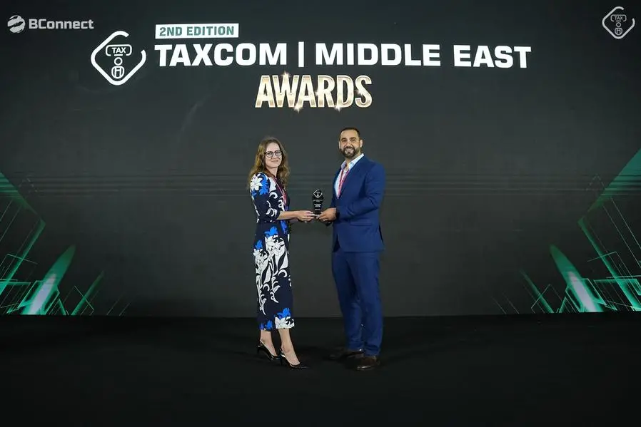 Comarch receiving the award at Taxcom Middle East Summit & Awards. Image Courtesy: Comarch