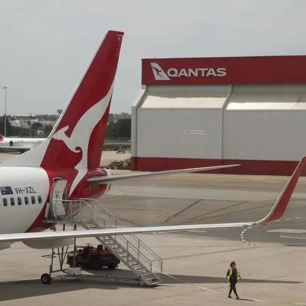 Australia's Qantas lifts domestic revenue estimates, shares hit record high