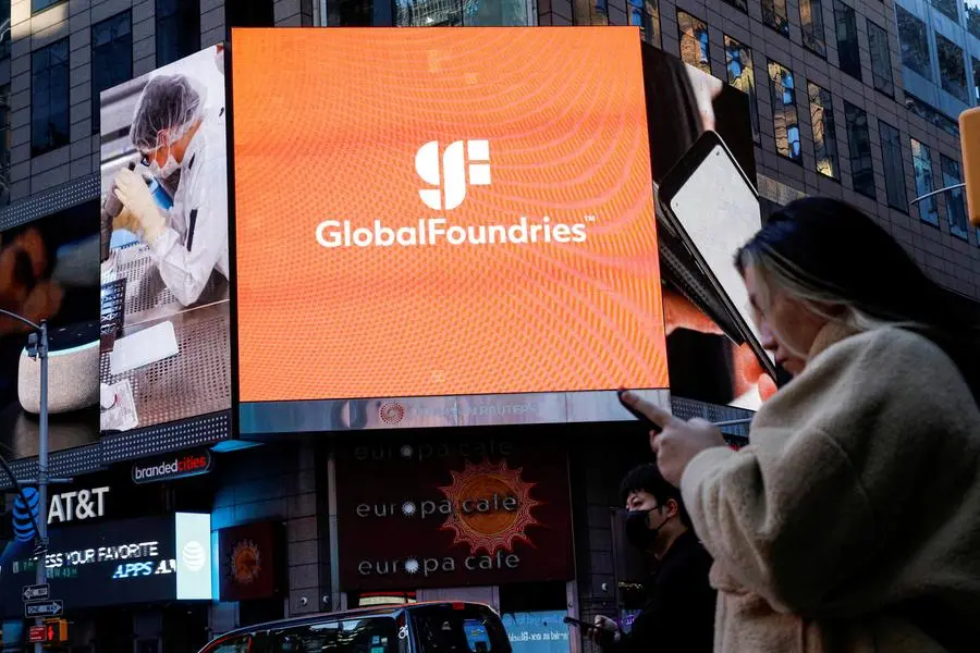 FILE PHOTO: A screen displays the company logo for semiconductor and chipmaker GlobalFoundries Inc. during the company\\'s IPO at the Nasdaq MarketSite in Times Square in New York City, U.S., October 28, 2021. REUTERS/Brendan McDermid. , Reuters