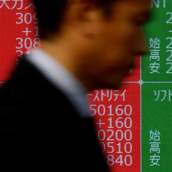 Asia shares steady; gold at record high as trade war ratchets up