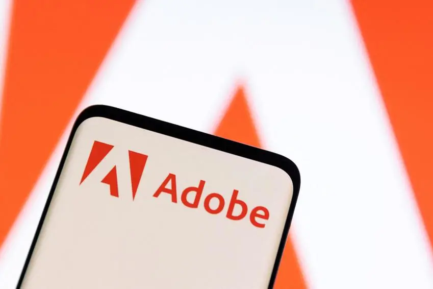 FILE PHOTO: Adobe logo is seen on smartphone in this illustration taken June 13, 2022. REUTERS/Dado Ruvic/Illustration. , Reuters