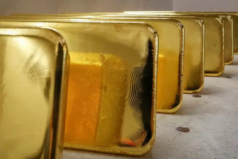 FILE PHOTO: Newly casted ingots of 99.99 percent pure gold are stored after weighing at the Krastsvetmet non-ferrous metals plant, one of the world\\'s largest producers in the precious metals industry, in the Siberian city of Krasnoyarsk, Russia November 22, 2018.REUTERS/Ilya Naymushin. , Reuters