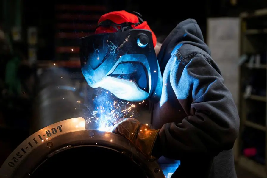 A worker welds a steel tube at HCC, a company that uses parts to make combines, at the factory in Mendota, Illinois, U.S., February 21, 2025. REUTERS/Vincent Alban. , Reuters