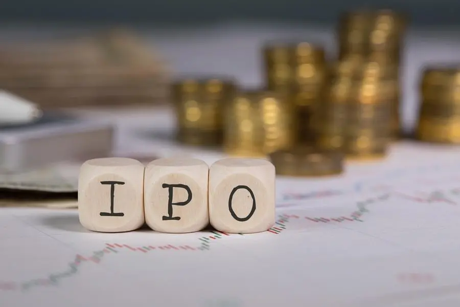 Abbreviation IPO composed of wooden letters. Stacks of coins in the background. Closeup. Image used for illustrative purpose. Getty Images , Getty Images