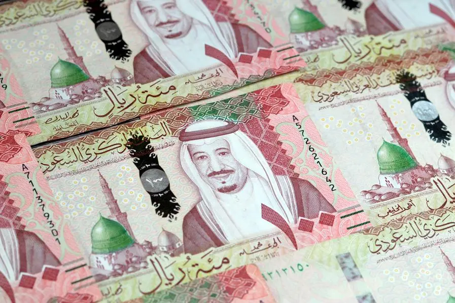Saudi Arabia 100 riyals banknotes, The Saudi riyal is the currency of Saudi Arabia, Saudi kingdom one hundred riyals with the photo of king Salman Bin Abdulaziz and Madinah Prophet mosque, selective focus. Image used for illustrative purpose. Getty Images , Getty Images