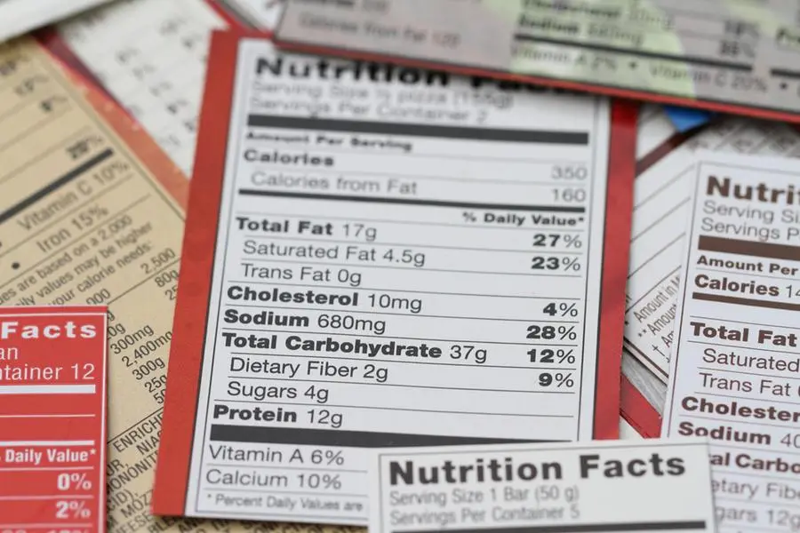 Various nutrition labels for a variety of packaged food products. Labels show calories, fat content, cholesterol, carbohydrates, protein, sodium, sugars, daily recommended litmits, vitamins and specfic ingredients in the foods. Prominent top label shows a whopping 680 mg soldium in the food product. Image used for illustrative purpose. Image courtesy: Getty Images/ NoDerog , Getty Images