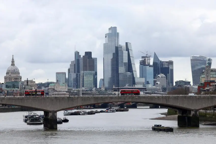 FILE PHOTO: Buses cross Waterloo Bridge with the City of London financial district seen behind, in London, Britain, March 5, 2024. REUTERS/Toby Melville. , Reuters
