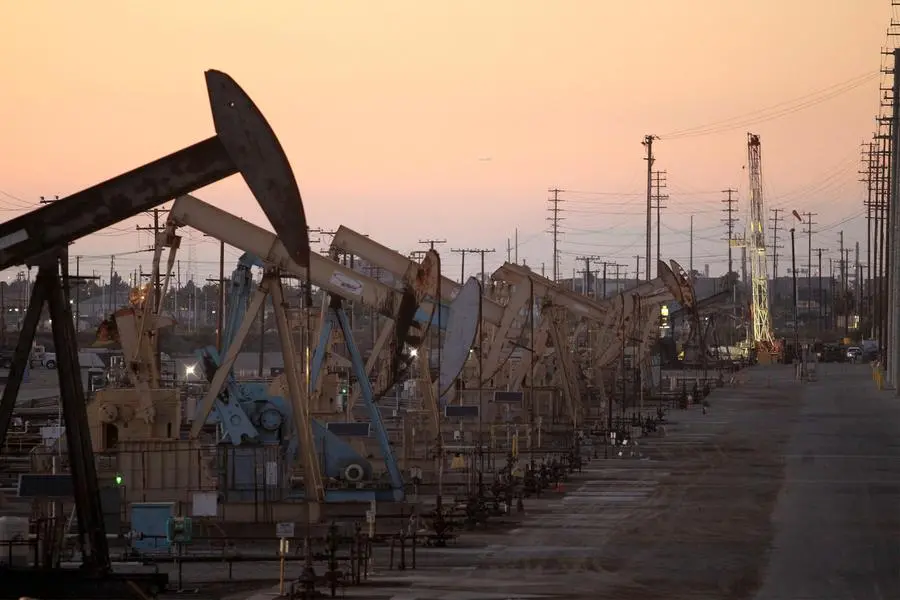 FILE PHOTO: Oil rig pumpjacks, also known as thirsty birds, extract crude from the Wilmington Field oil deposits area where Tidelands Oil Production Company operates near Long Beach, California July 30, 2013. REUTERS/David McNew. , Reuters