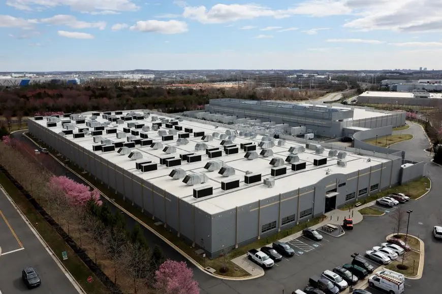 A car drives past a building of the Digital Reality Data Center in Ashburn, Virginia, U.S., March 17, 2025. REUTERS/Leah Millis. , Reuters