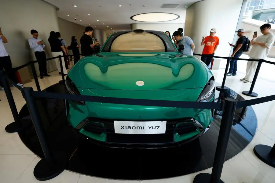People look at the new electric SUV YU7 displayed at a Xiaomi store in Beijing, China May 29, 2025. REUTERS/Tingshu Wang. , Reuters